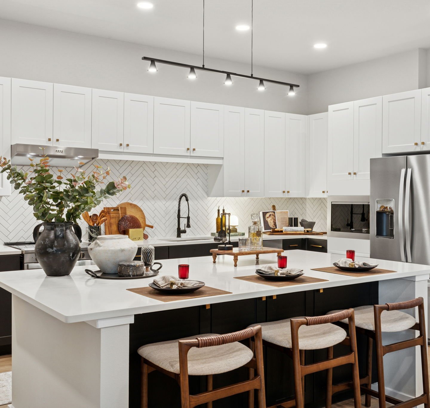 Kitchen with stainless steel appliances and large island with wood flooring