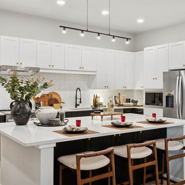 Kitchen with stainless steel appliances and large island with wood flooring
