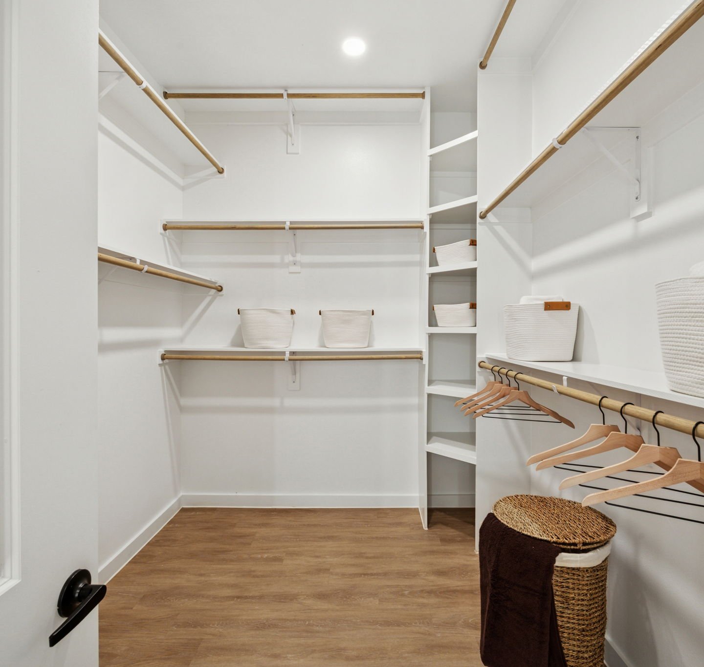 large walk in closet with built in shelving